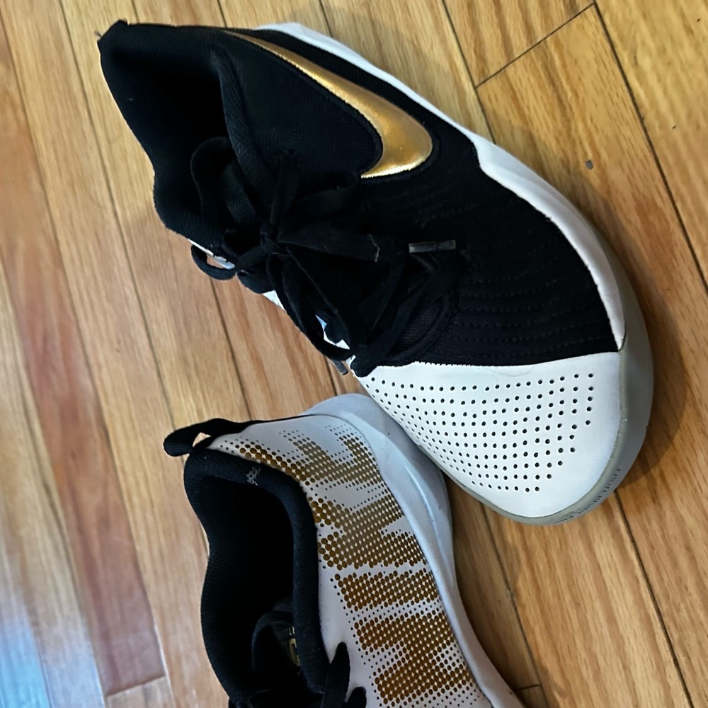 Nike Women's Black, White, and Gold Sneakers
